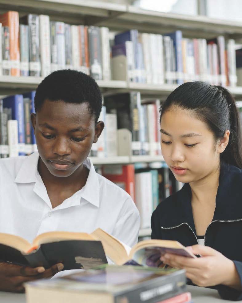 African and Chinese student reading English book